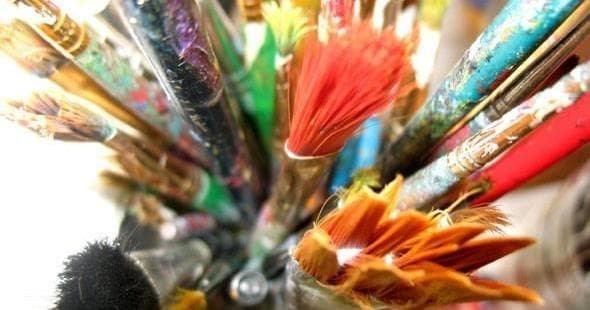 Close-up colorful paintbrushes and bristles, creative tools shot