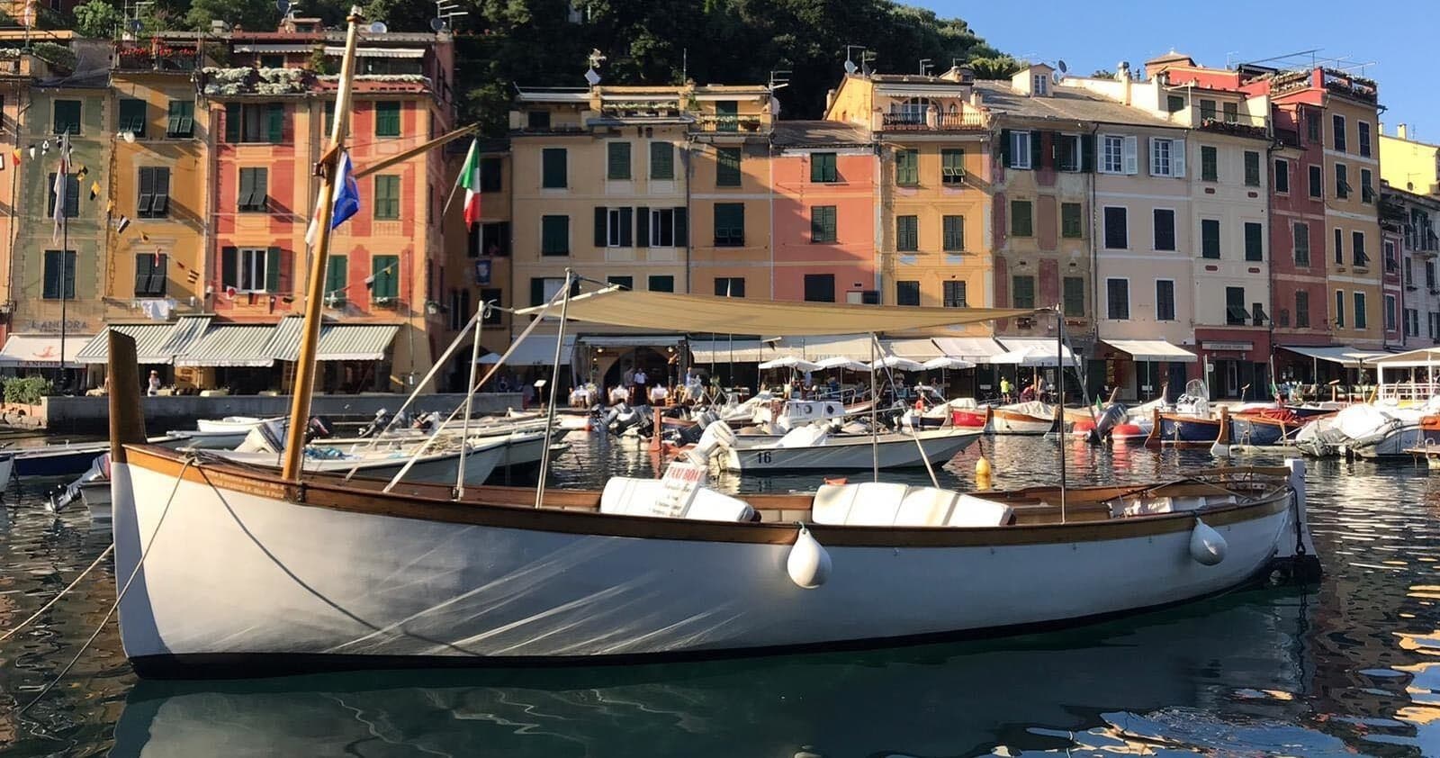 Classic wooden boat moored in Portofino harbor, scenic view