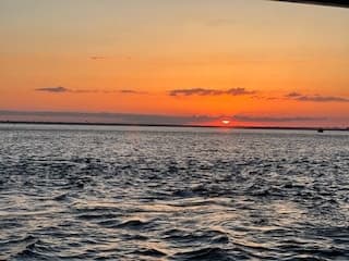 Sunset Bubbles & Beignets with Bluewater Pontoon Charters in Destin