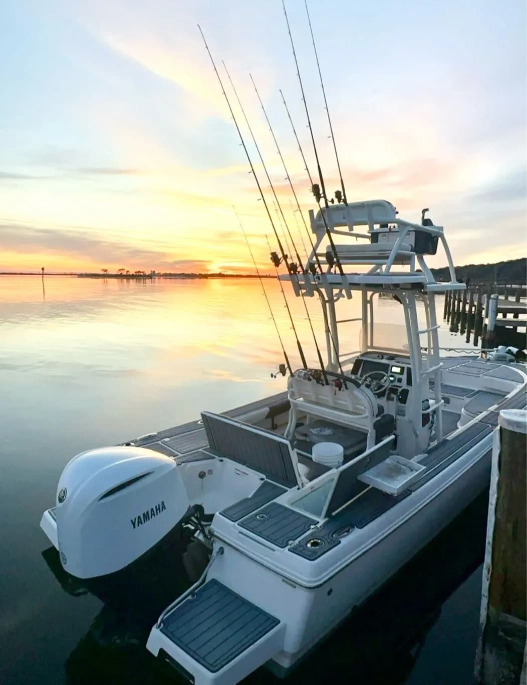 Sportfishing boat docked at sunrise on coastal marina