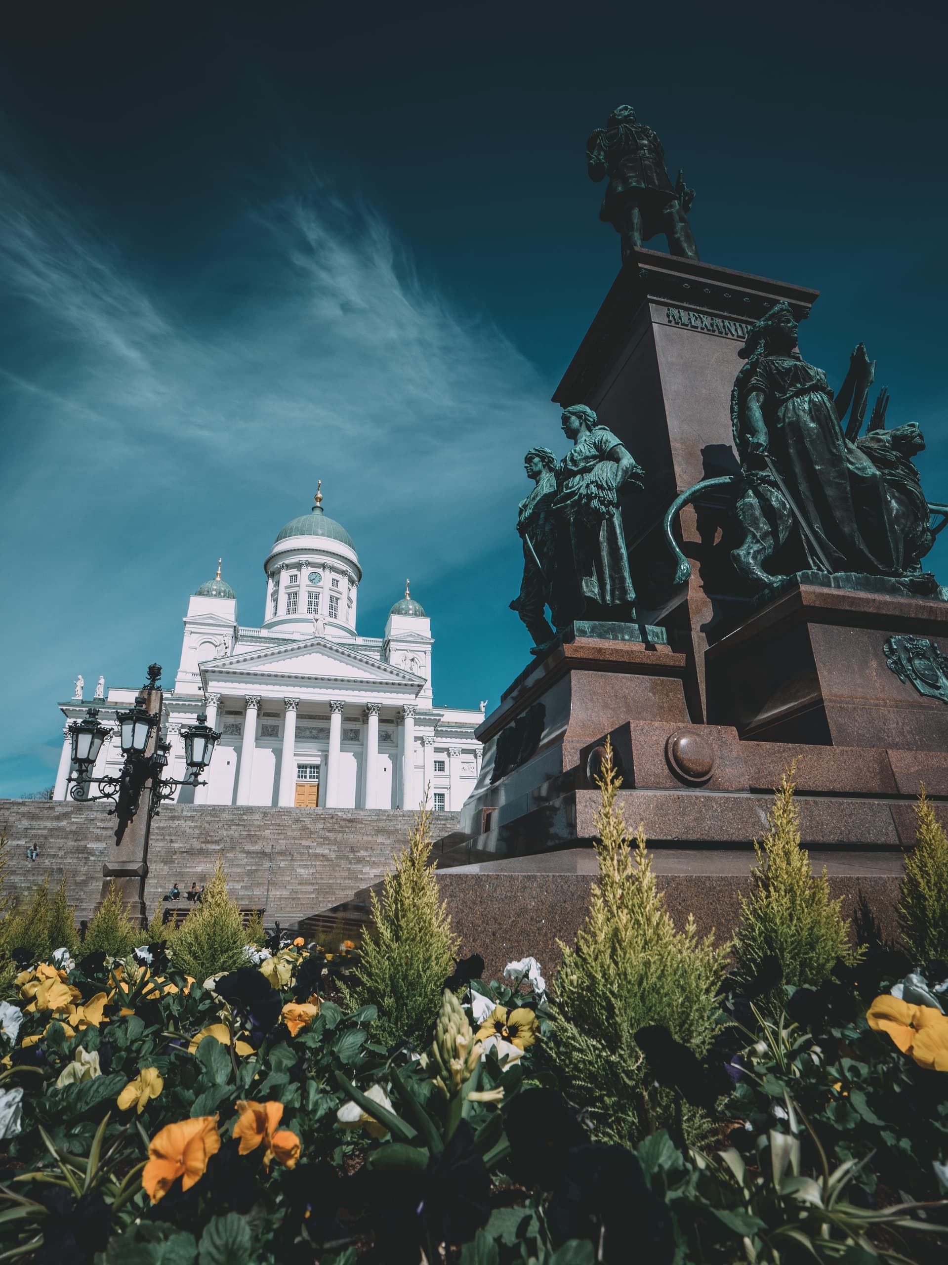 Helsinki cathedral and monument with flowers in foreground