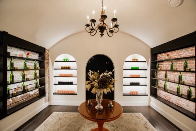 Candle studio retail interior with shelves of candles and decor