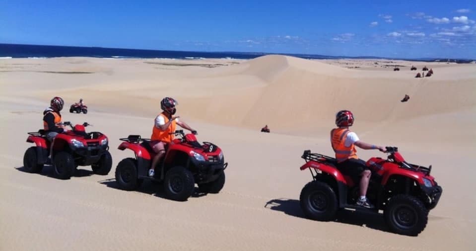 Ride the Worimi Dunes: 1.5-Hour Aboriginal Quad Bike & Sandboarding Tour at Stockton Beach
