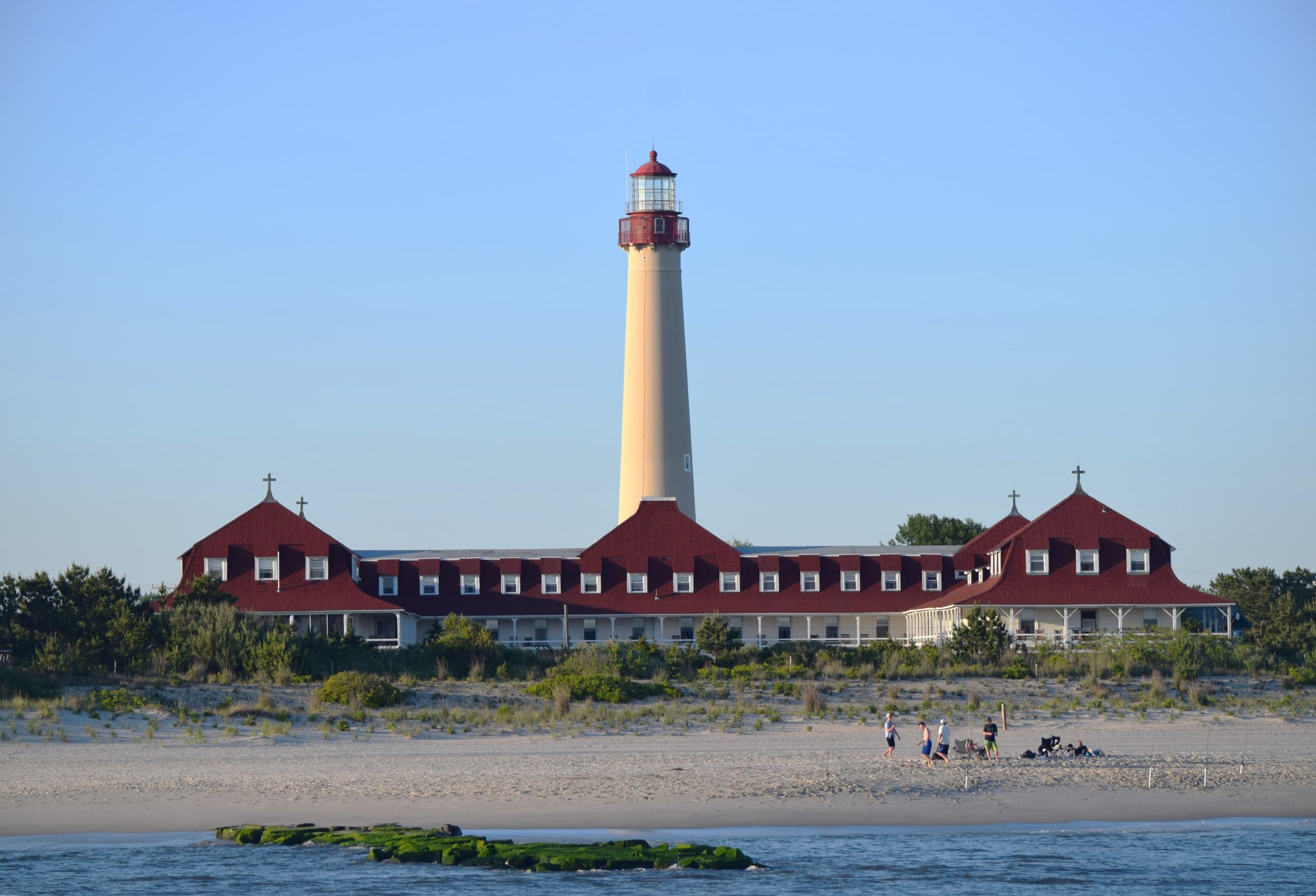 Scenic Cape May lighthouse overlooking sandy beach coastal vista