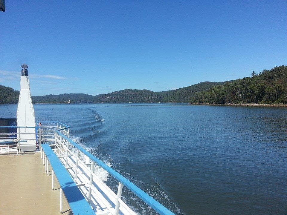 Ferry deck leading into calm river, panoramic riverboat cruise