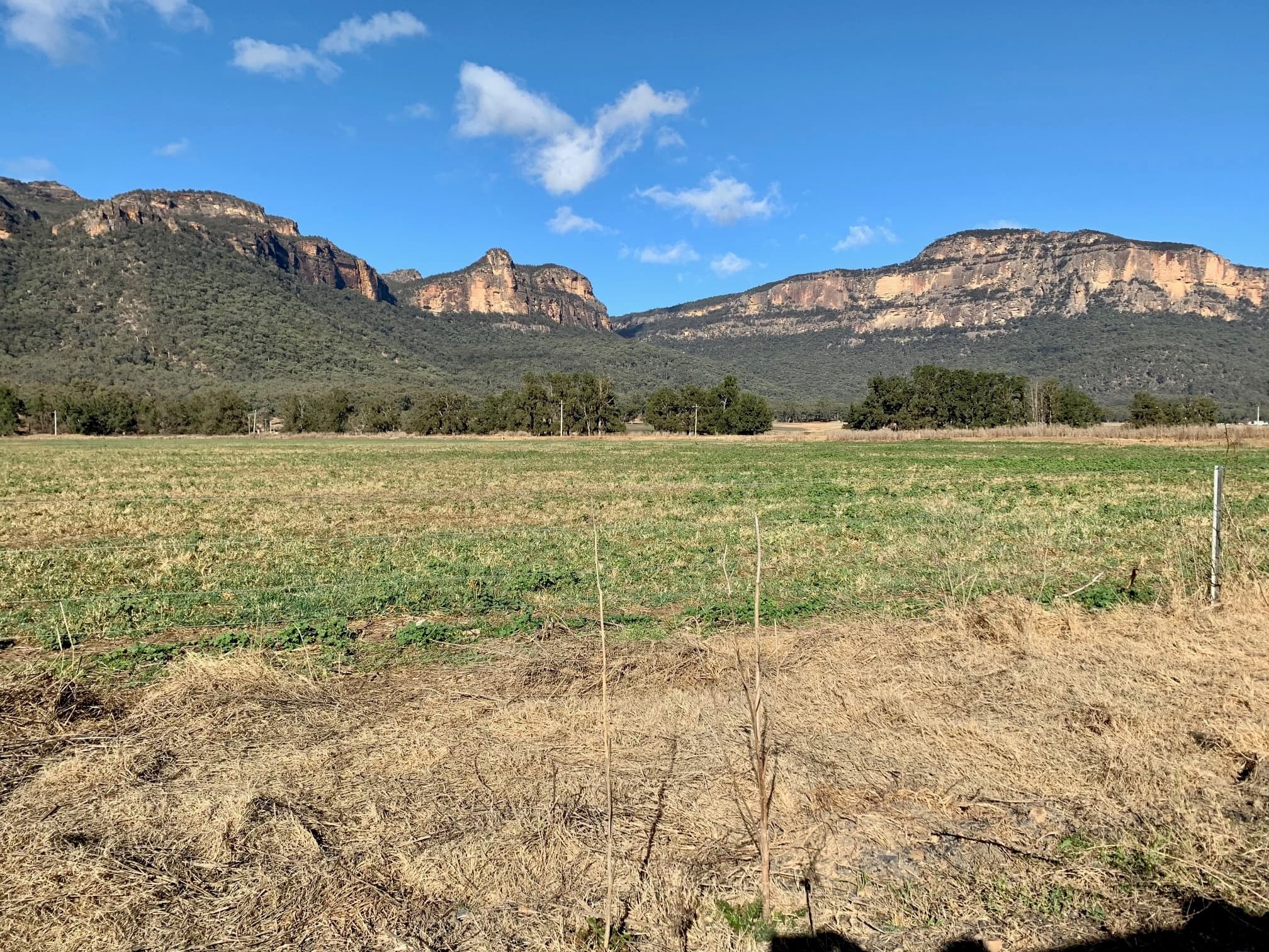 Wide mountain and farmland vista in Australia for hiking/birding