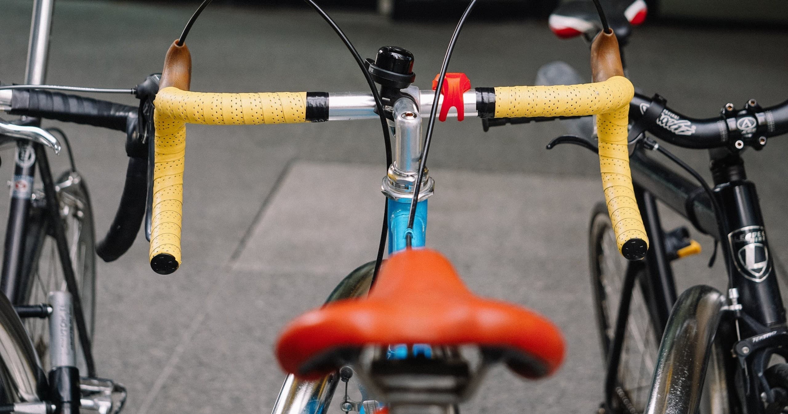 Colorful road bike parked on urban street, ready for cycling