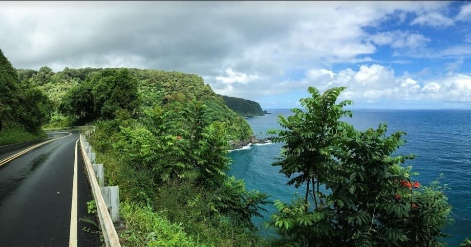 Coastal highway above ocean cliffs in Maui, scenic driving view