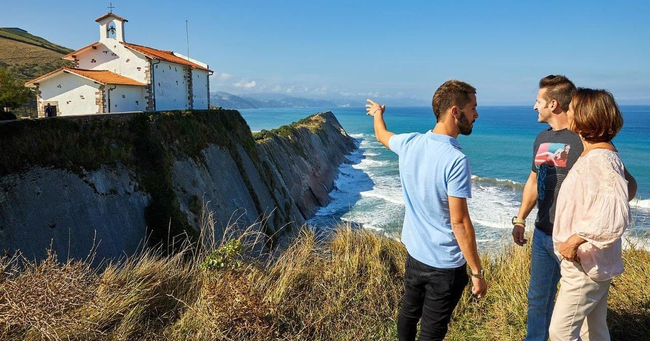 Coastal walking group enjoying cliffside views near San Sebastián