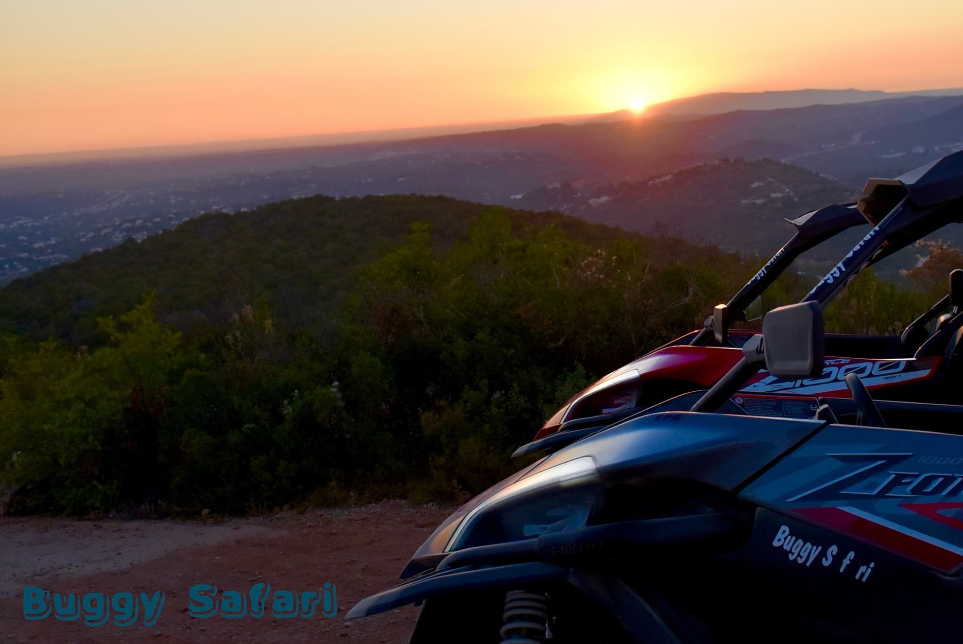 Off-road buggy at sunset overlooking coastal hills and valley