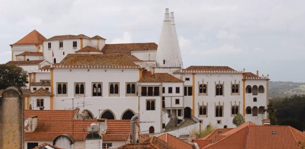 Historic white palace and townscape in Sintra hills, Portugal