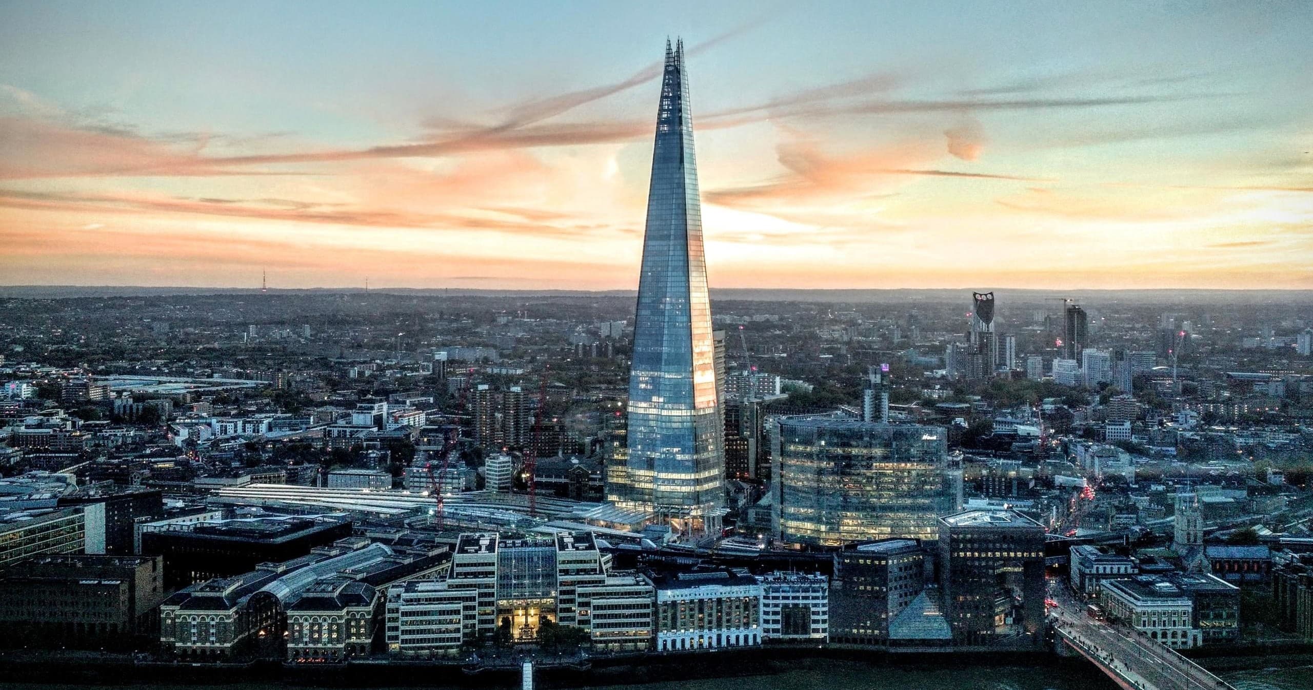 The Shard skyline at sunset over London cityscape