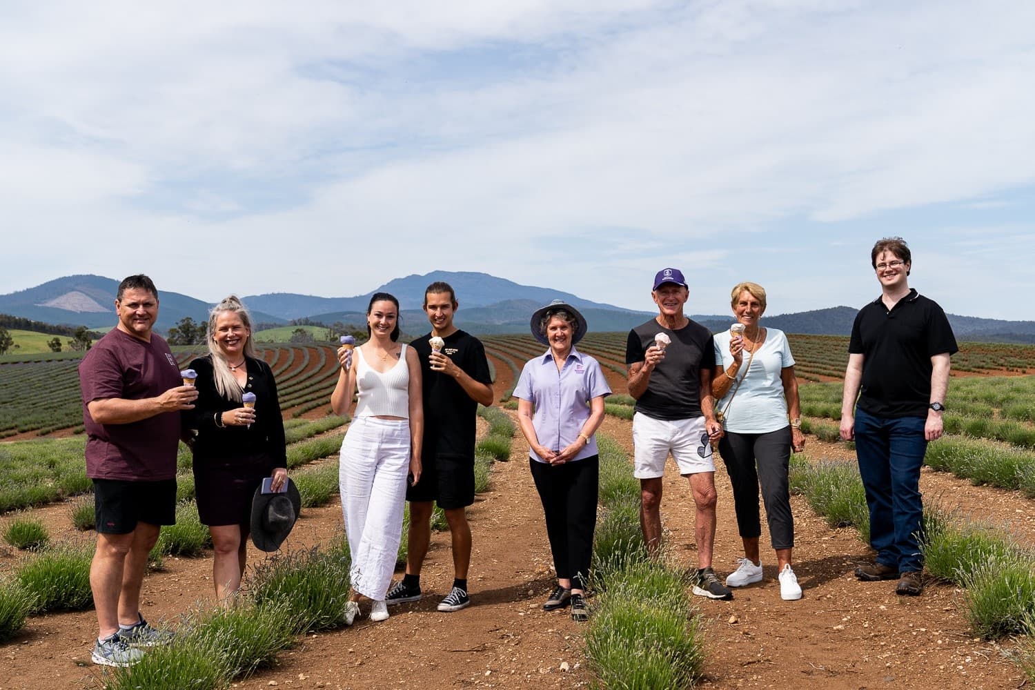 Group of visitors tasting lavender products during scenic farm tour