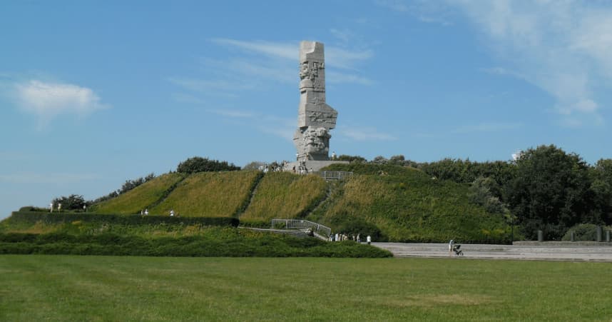 Coastal monument on grassy hilltop, historic outdoor landmark
