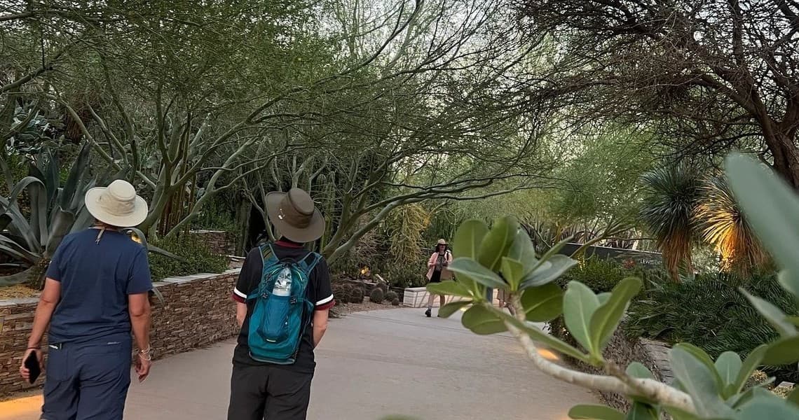 People walking desert garden path at Arizona sightseeing tour