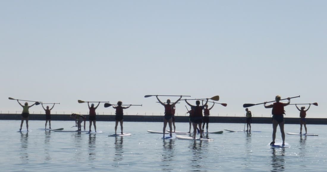 SUP Yoga at Montrose Harbor: Chicago Paddleboard Yoga with Mary Lou Cerami