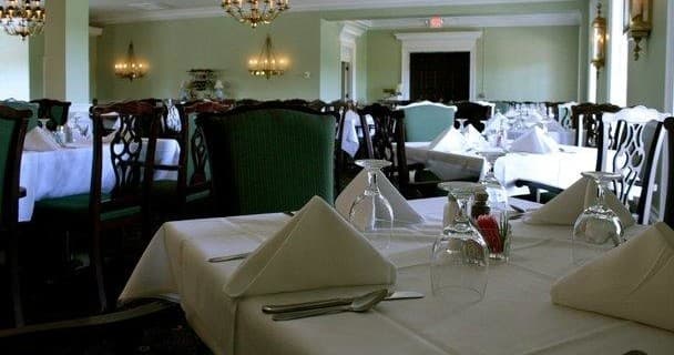 Fine dining room with set tables for visitors at Natural Bridge venue