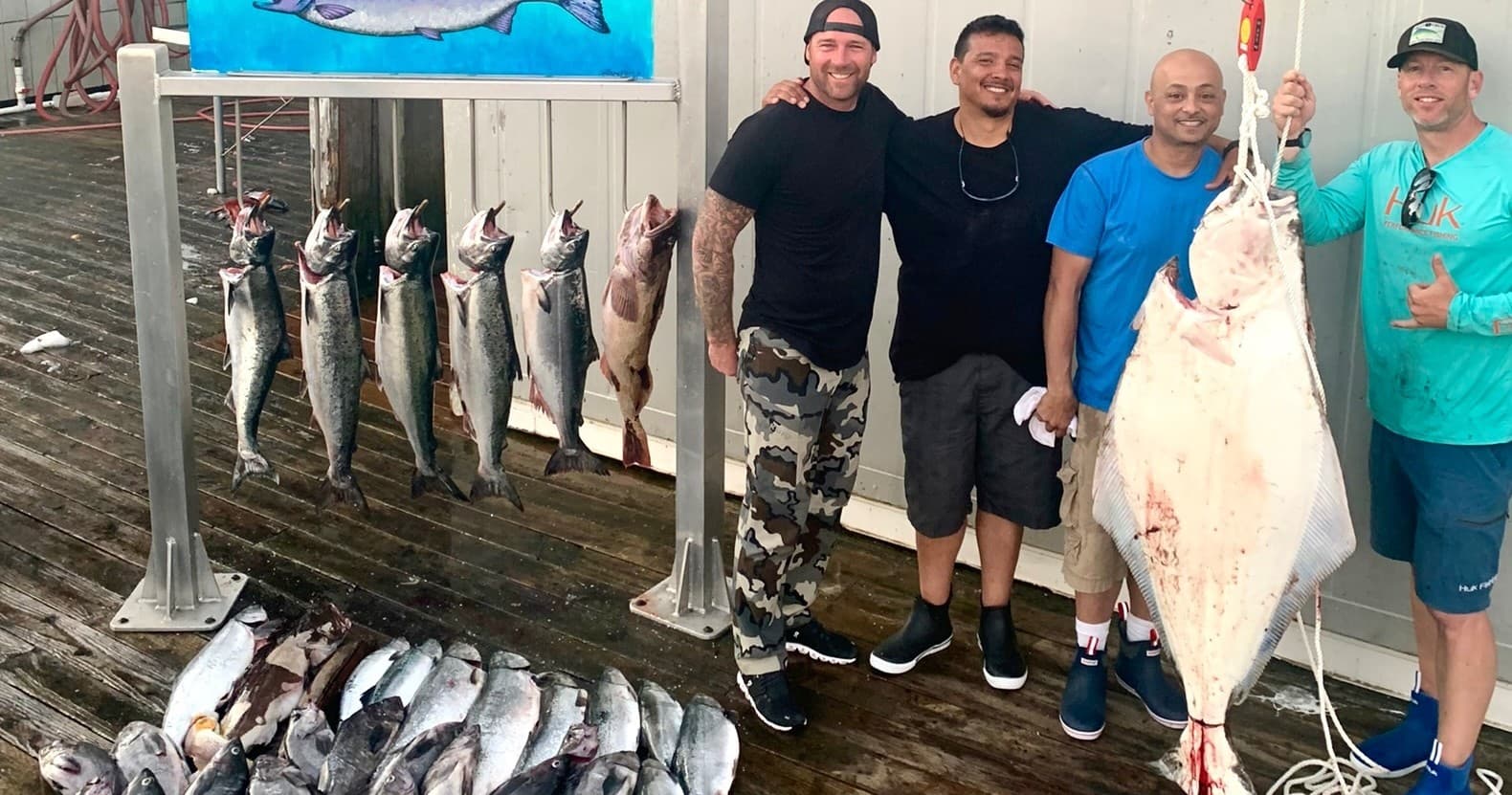 Anglers with large salmon catch on Alaska dock fishing trip