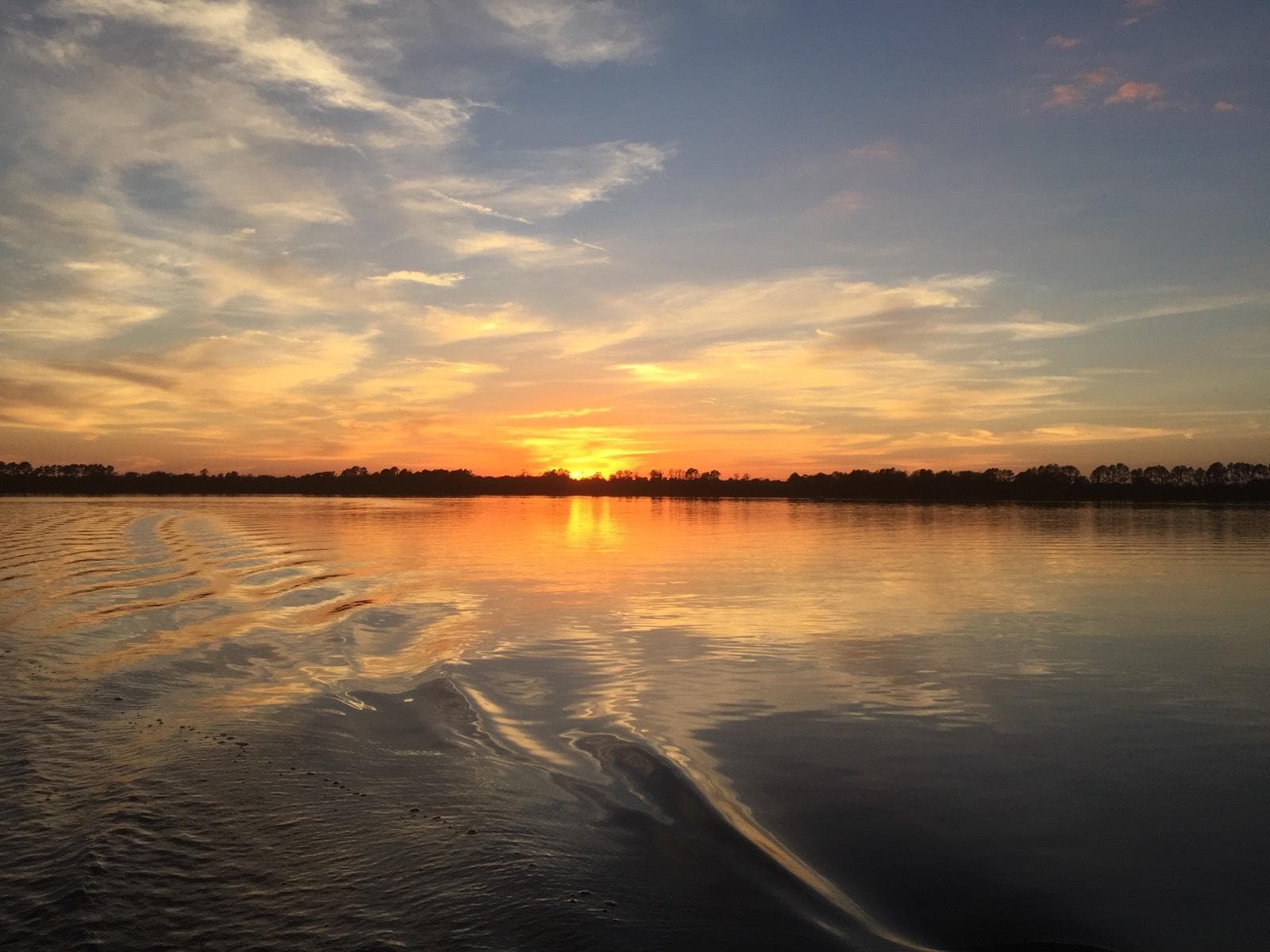 Scenic Florida sunset over tranquil river during boat tour