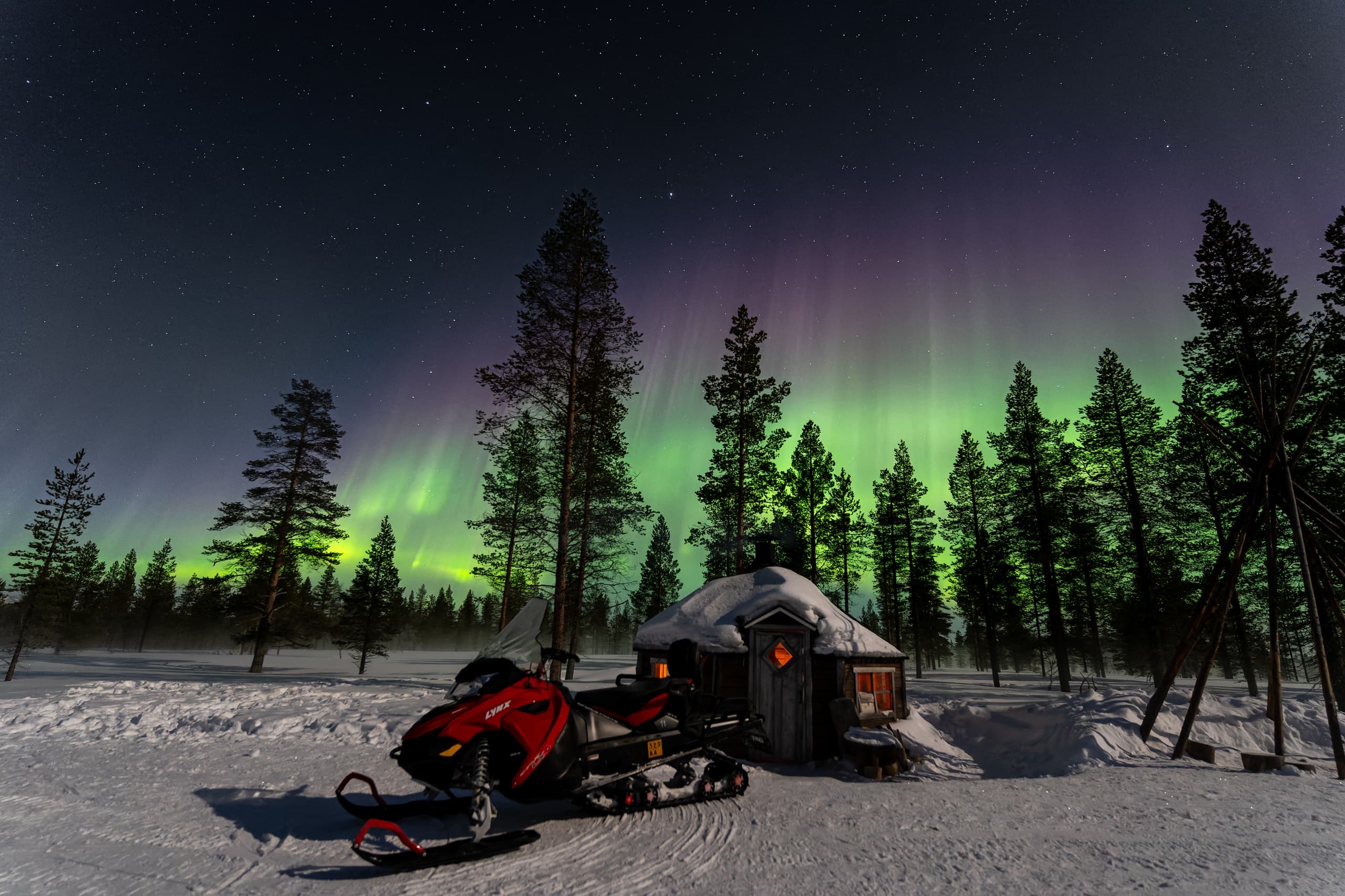 Winter Adventure: Aurora Snowmobiling Near Muotka