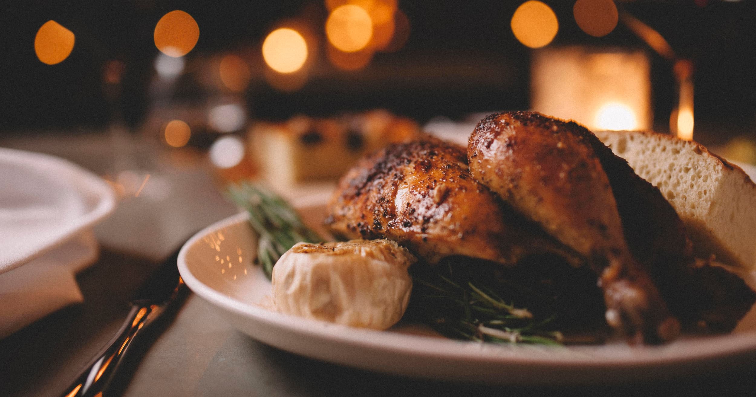 Roasted chicken entree plated for gourmet Southern dinner