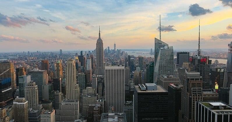 Panoramic Manhattan skyline at sunset from rooftop observation