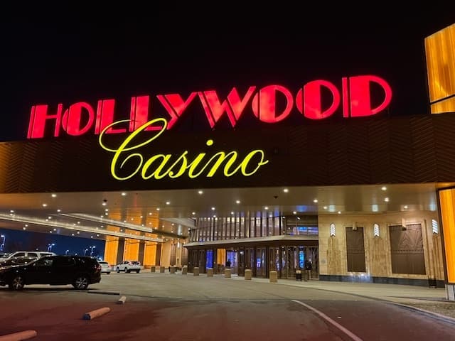 Hollywood Casino entrance lit at night, exterior drop-off