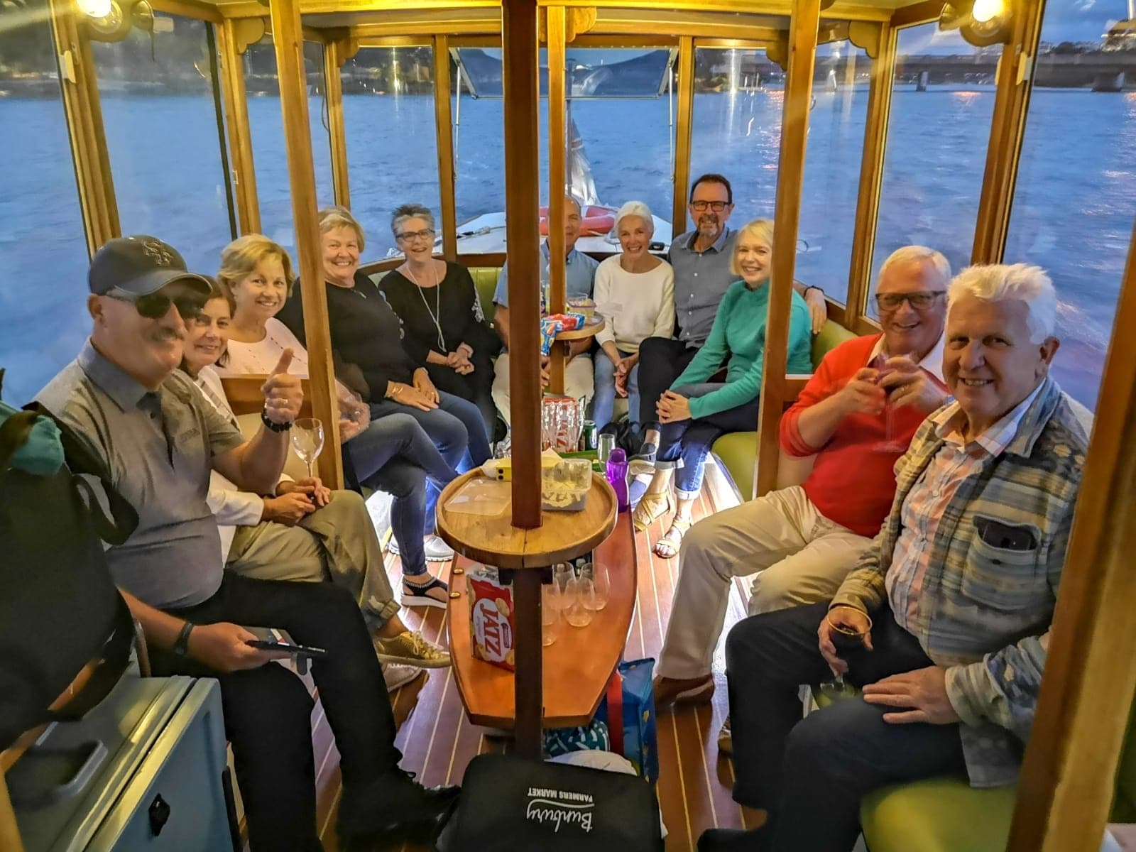 Group of passengers enjoying a small ferry ride on coastal waters