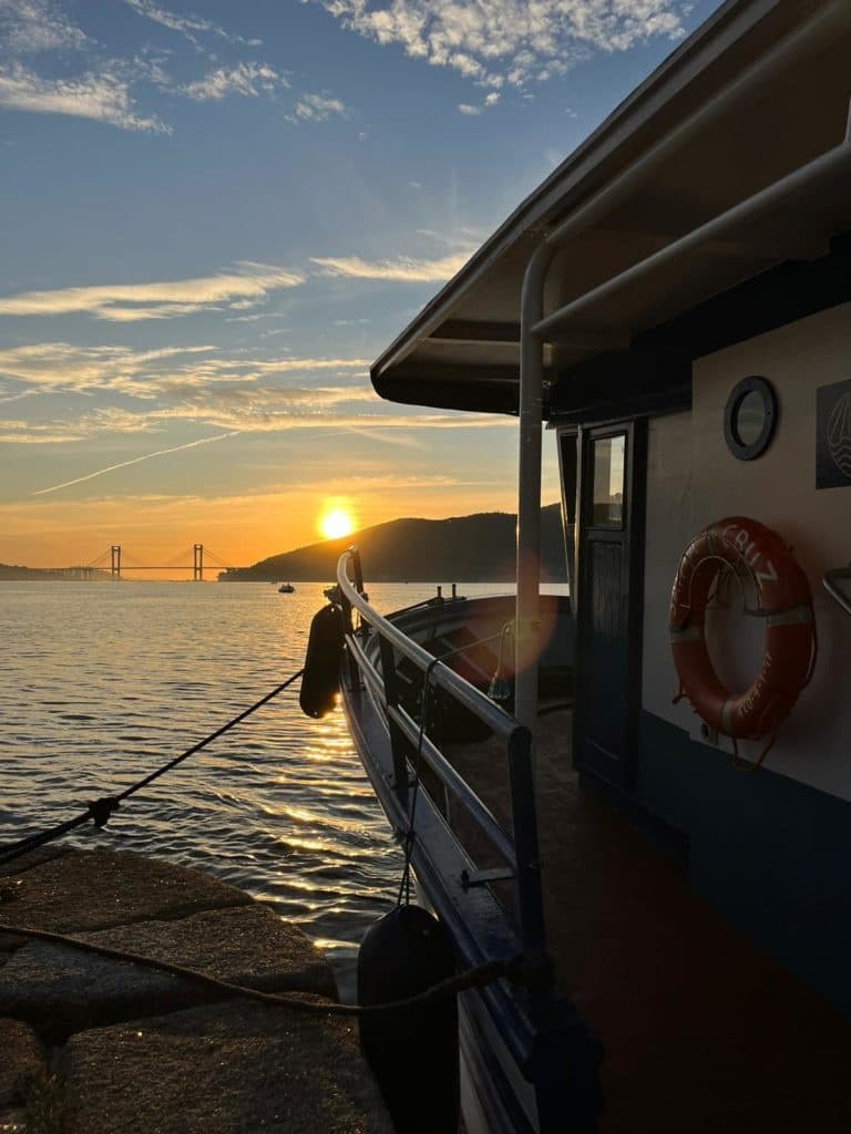 Cruise boat at sunset with lifebuoy and calm waters