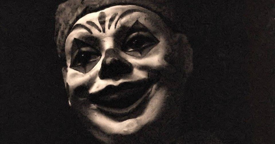 Creepy clown mask close-up poster for Salem haunted magic show