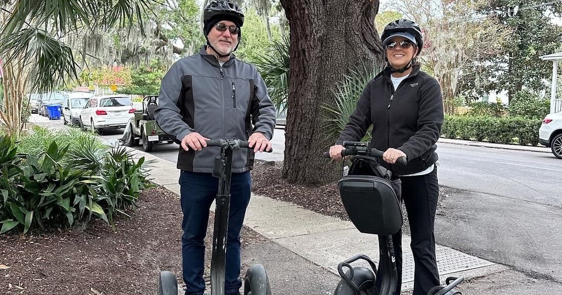 Couple on guided Segway tour among Charleston palms