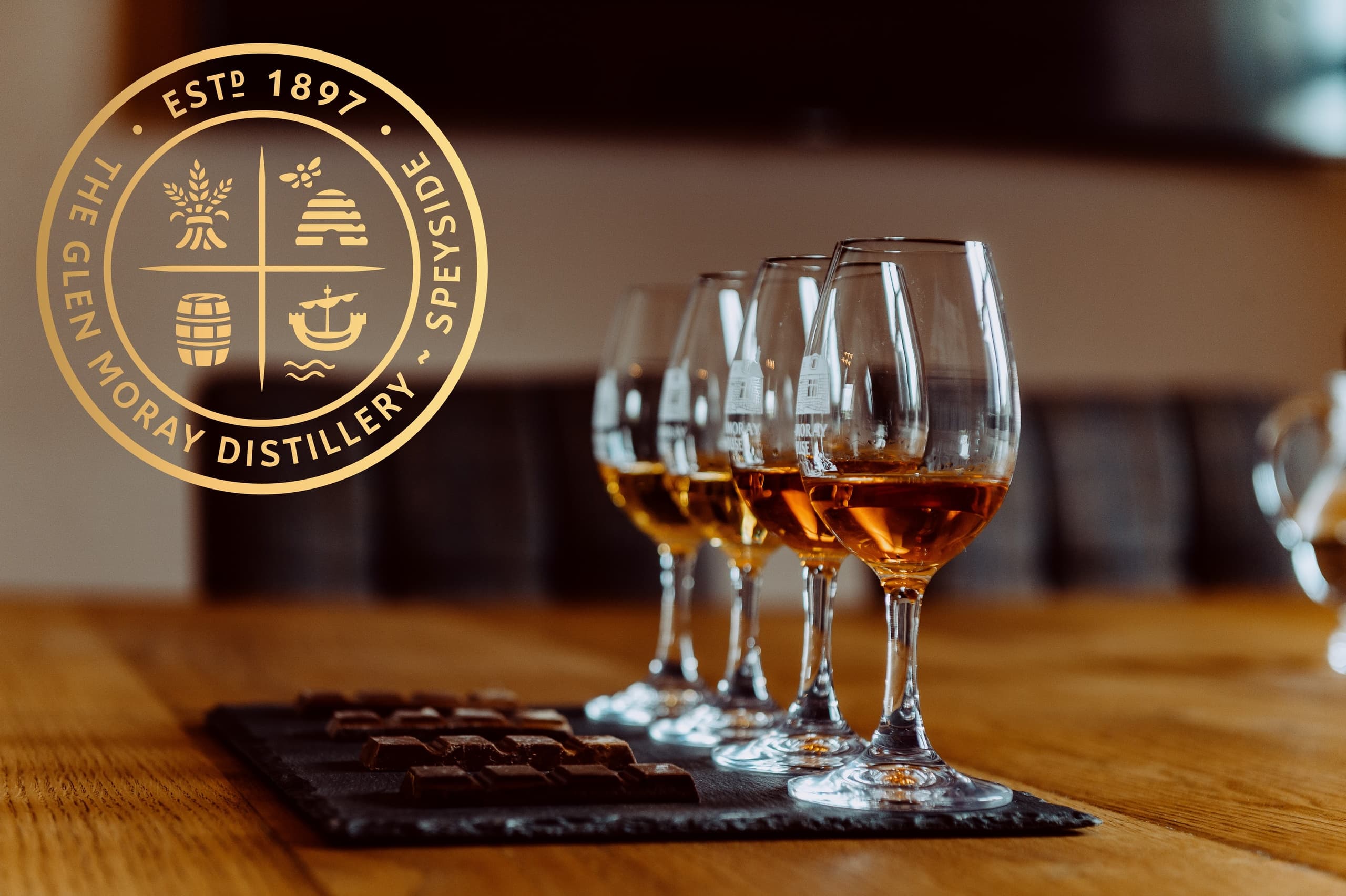 Tasting flight of whisky glasses at Glen Moray tasting room table