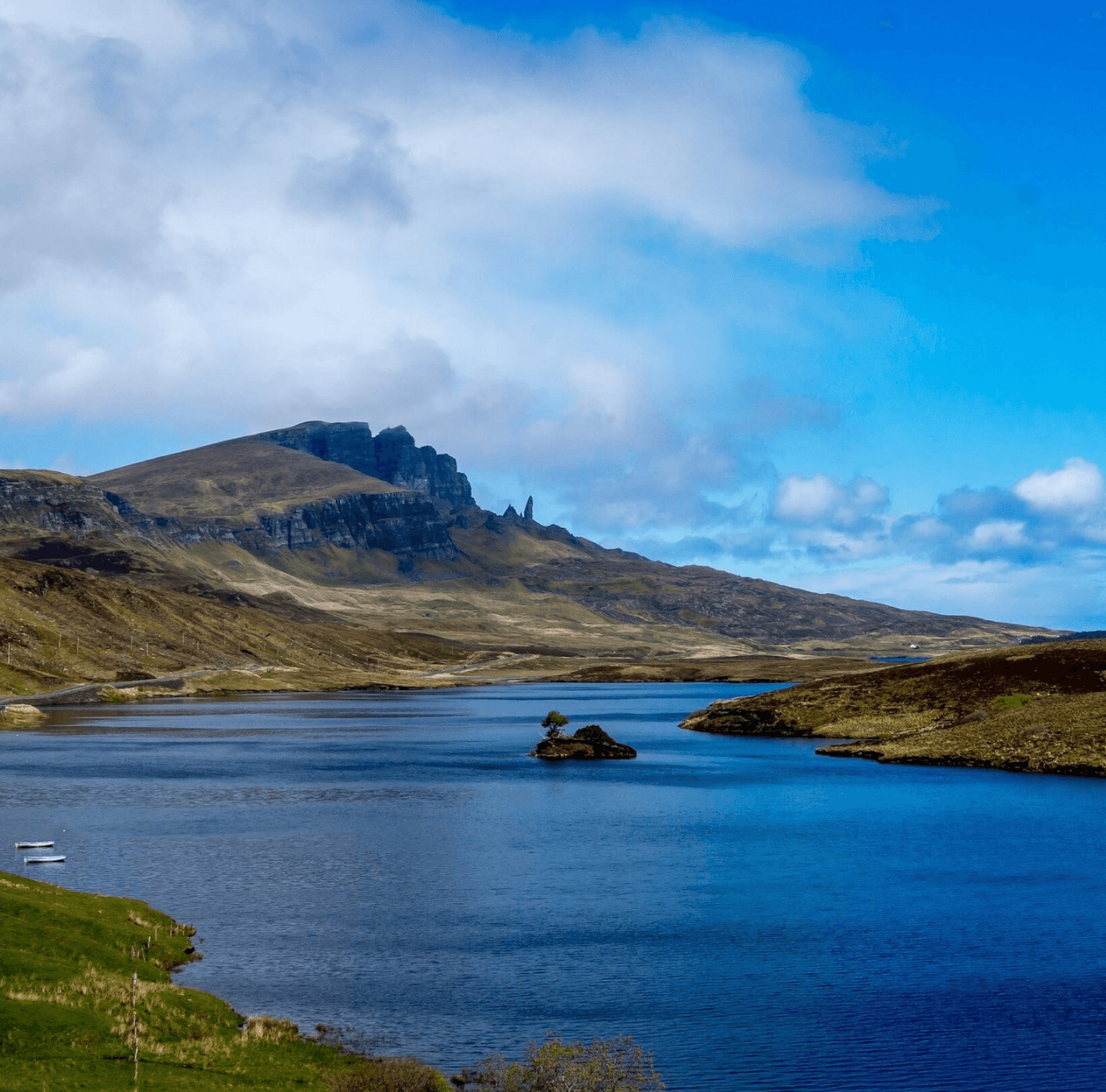 Serene loch and rugged hills, scenic Highland lake landscape