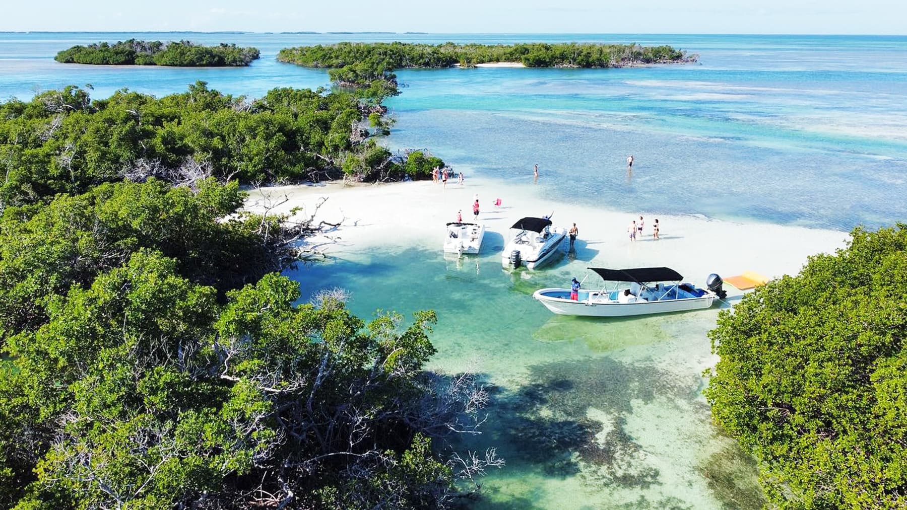 Aerial sandbar with boats and swimmers in Key West waters