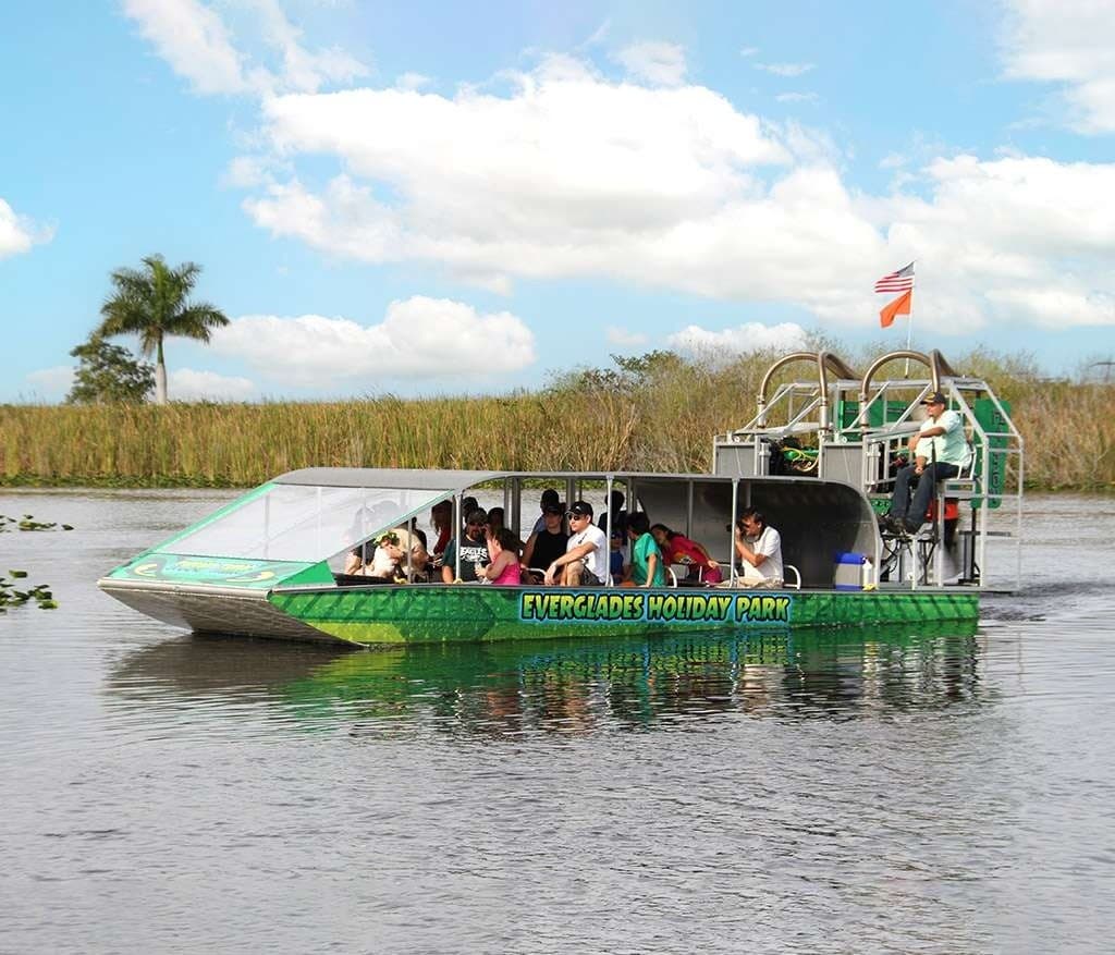 Scenic Everglades wetlands with airboat and expansive sky