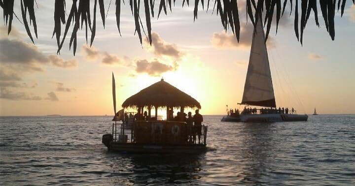 Cruise ship passing tropical sunset near Key West harbor
