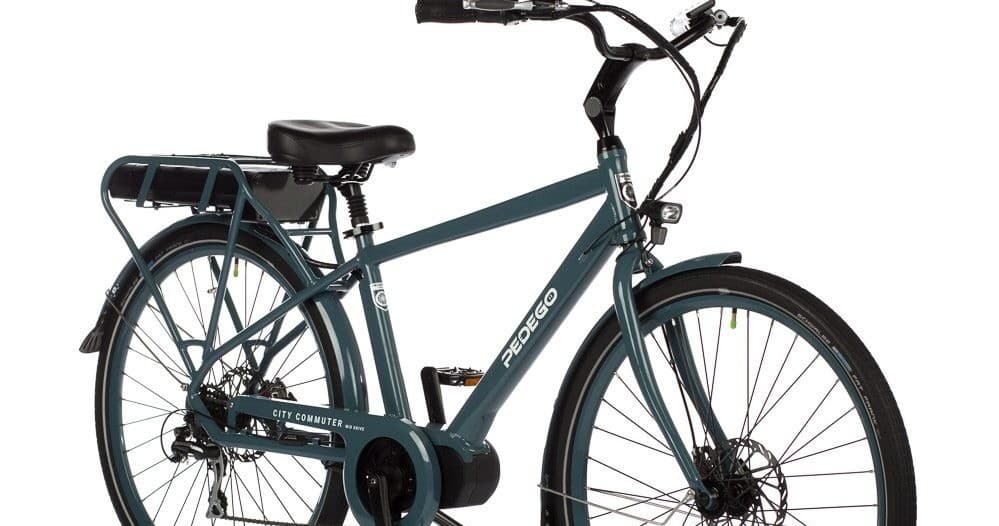 Teal electric city bike on white background, commuter rider-ready