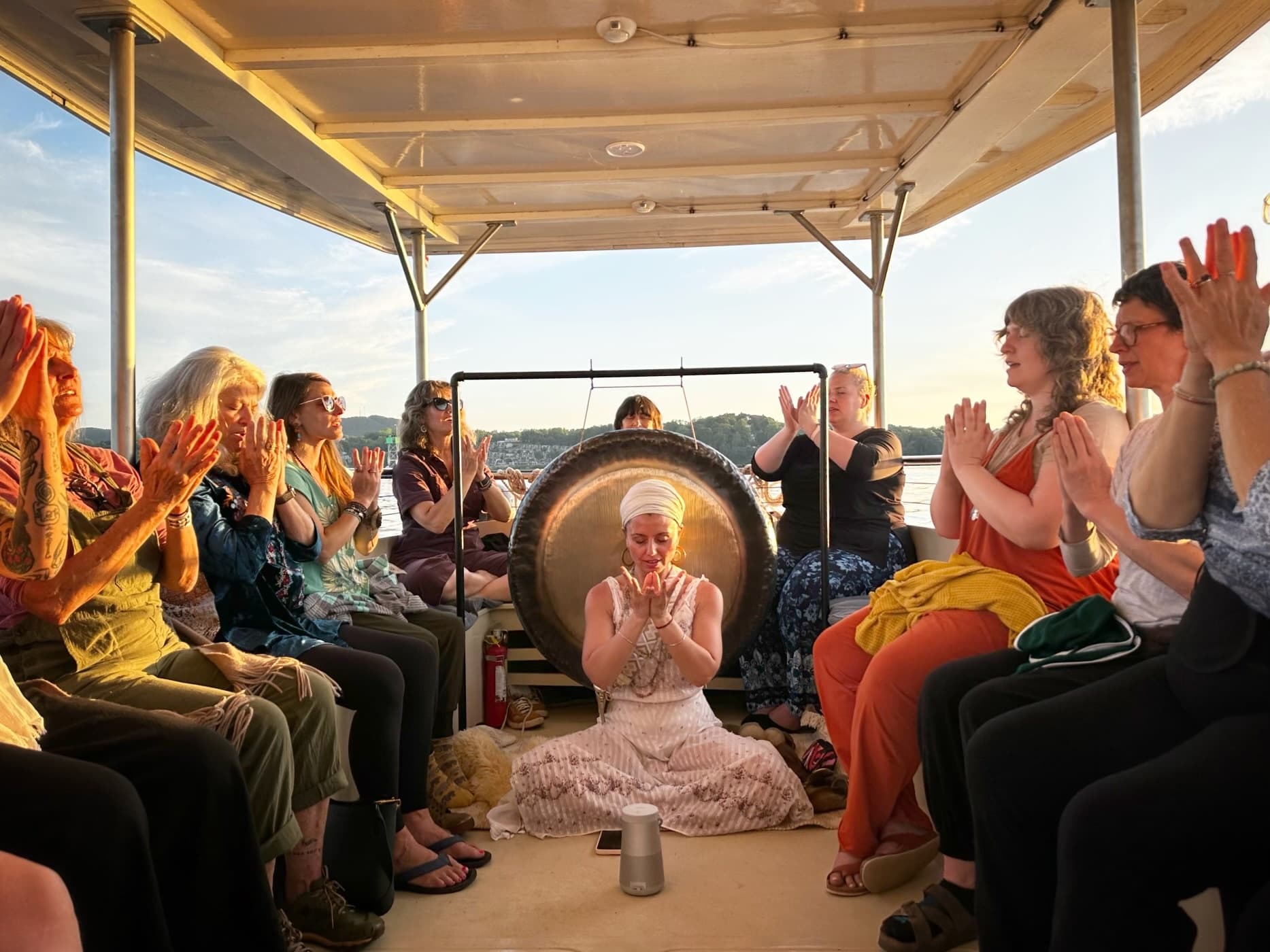 Sunset group boat meditation trip with communal drum session