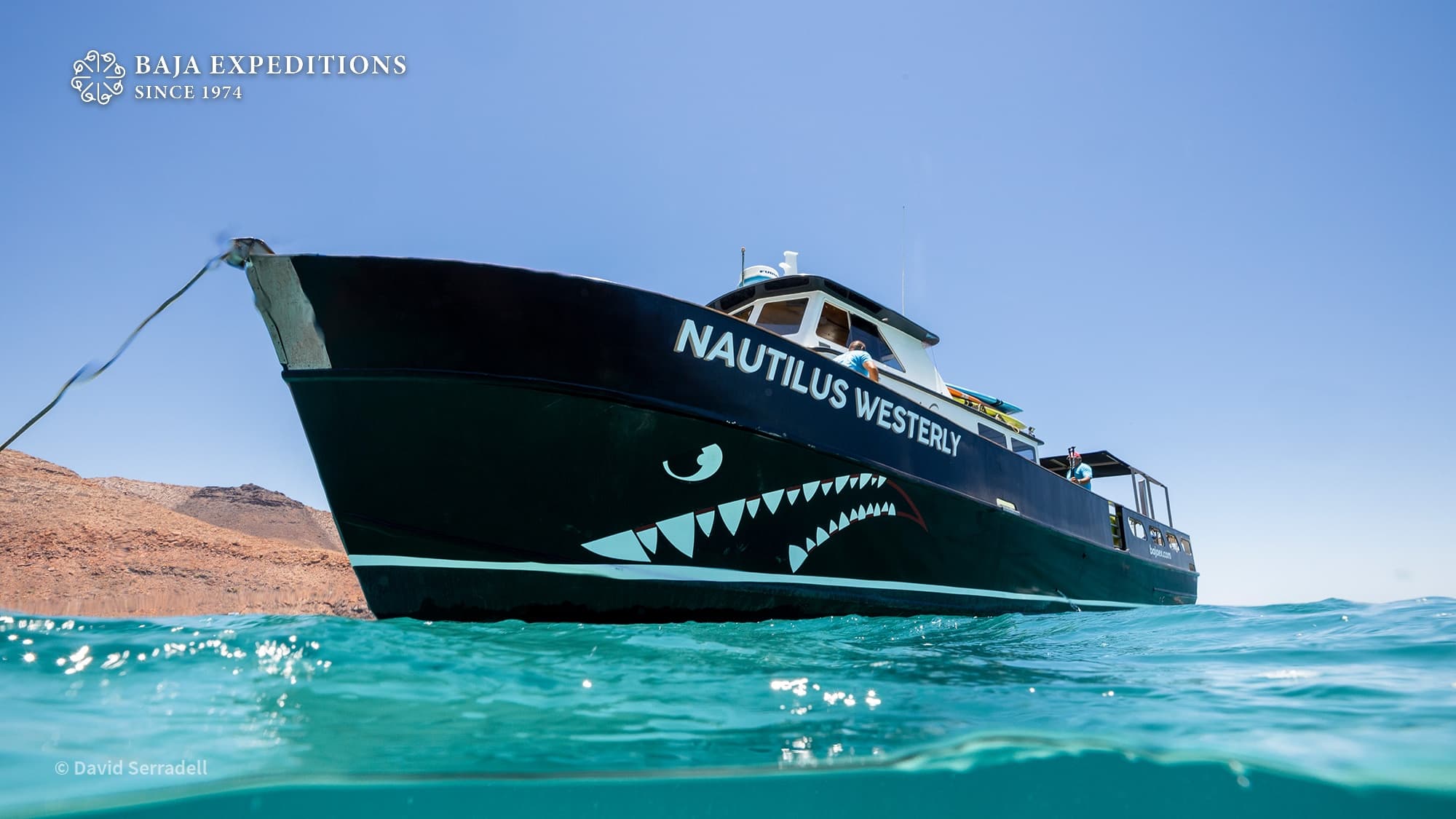 Expedition vessel anchored in calm Baja Sea of Cortez waters