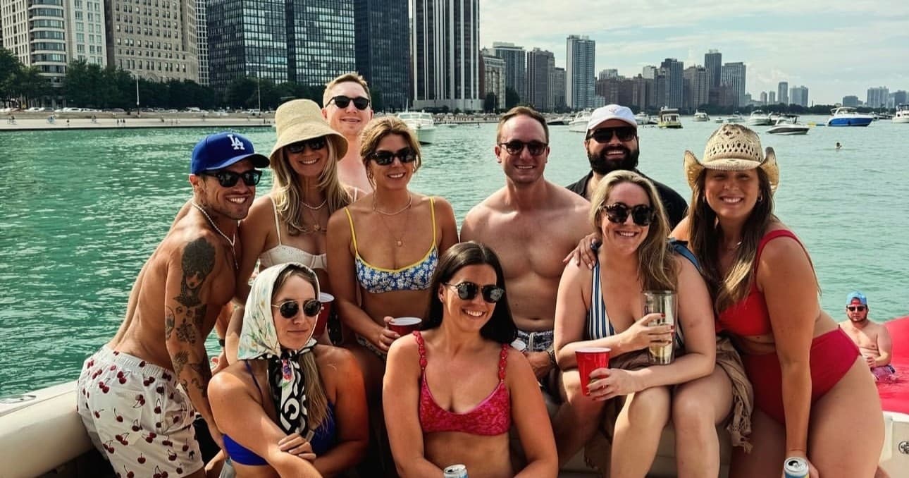 Boat party on Lake Michigan with Chicago skyline, group
