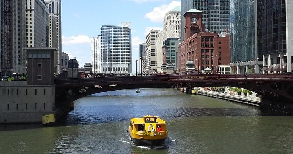 Chicago riverboat cruising under downtown bridges on architectural river tour
