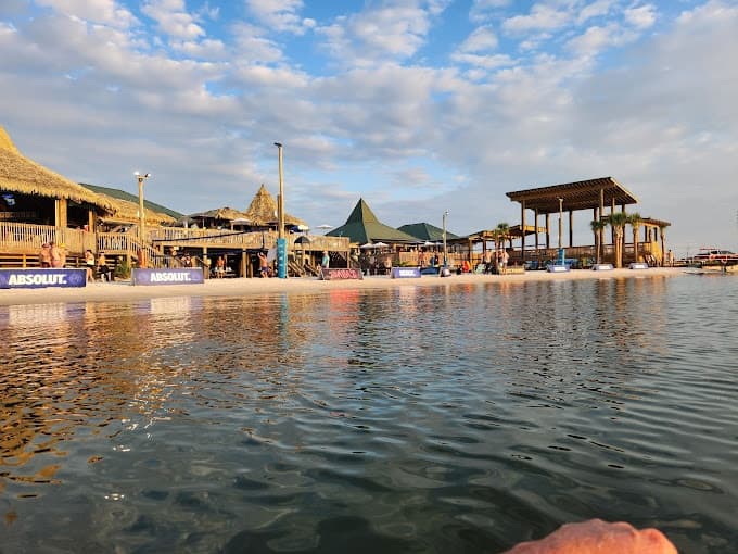 Coastal marina and beach resort waterfront at golden hour