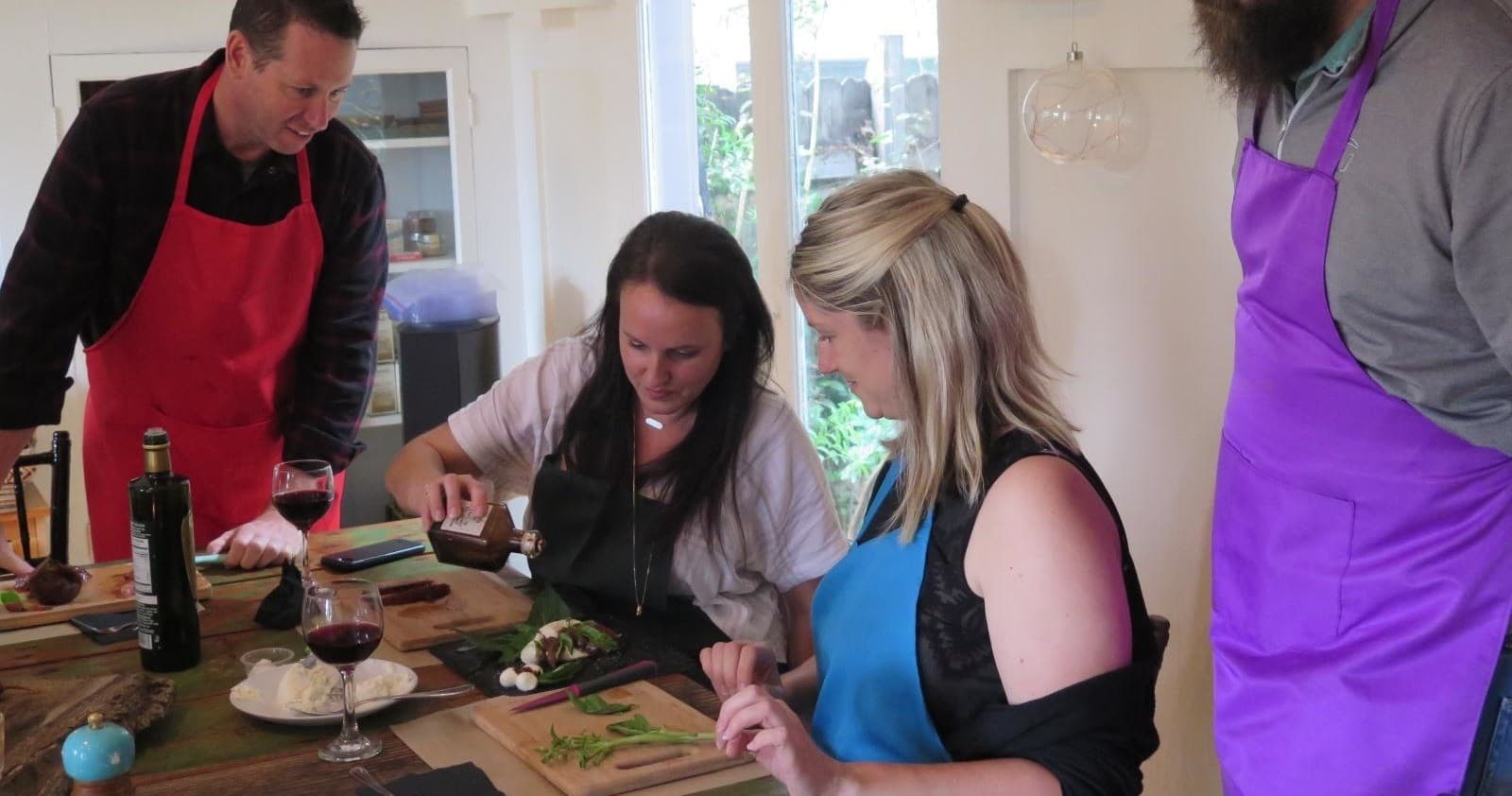 At-home cooking lesson with friends prepping ingredients