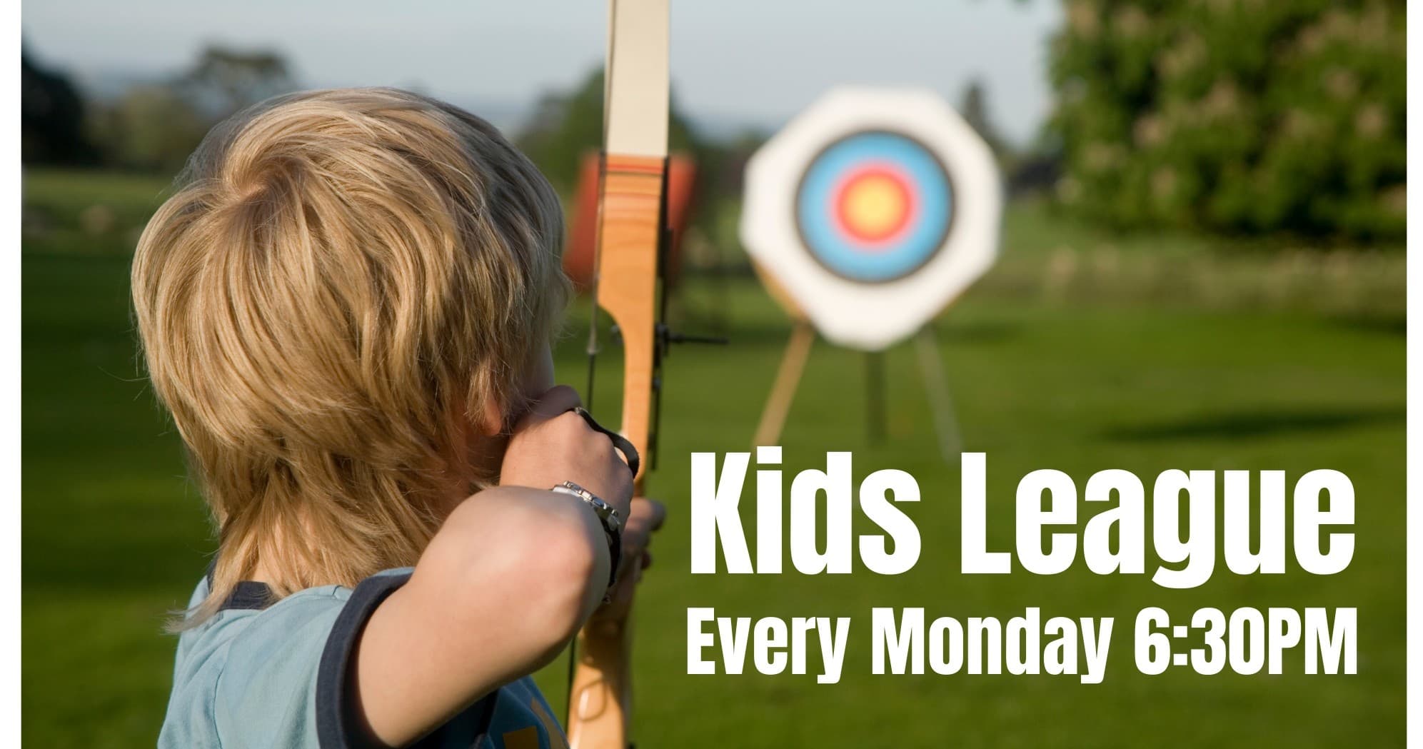 Child aiming bow at outdoor target on grassy range during kids league