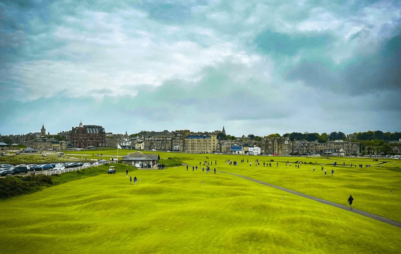 Expansive St Andrews links golf course greens on coastal landscape
