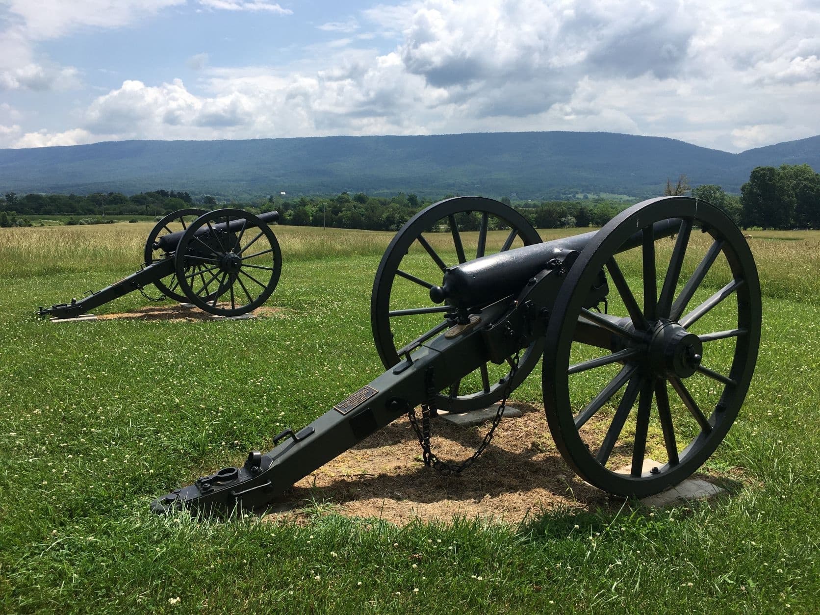 Civil War artillery cannons overlooking rolling countryside