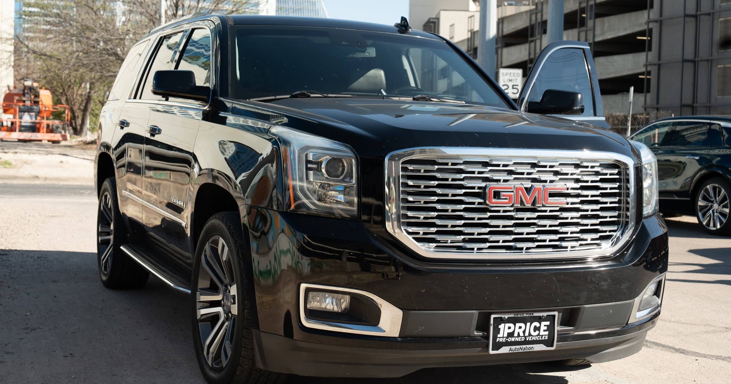 Black GMC SUV exterior parked in urban setting, transportation service