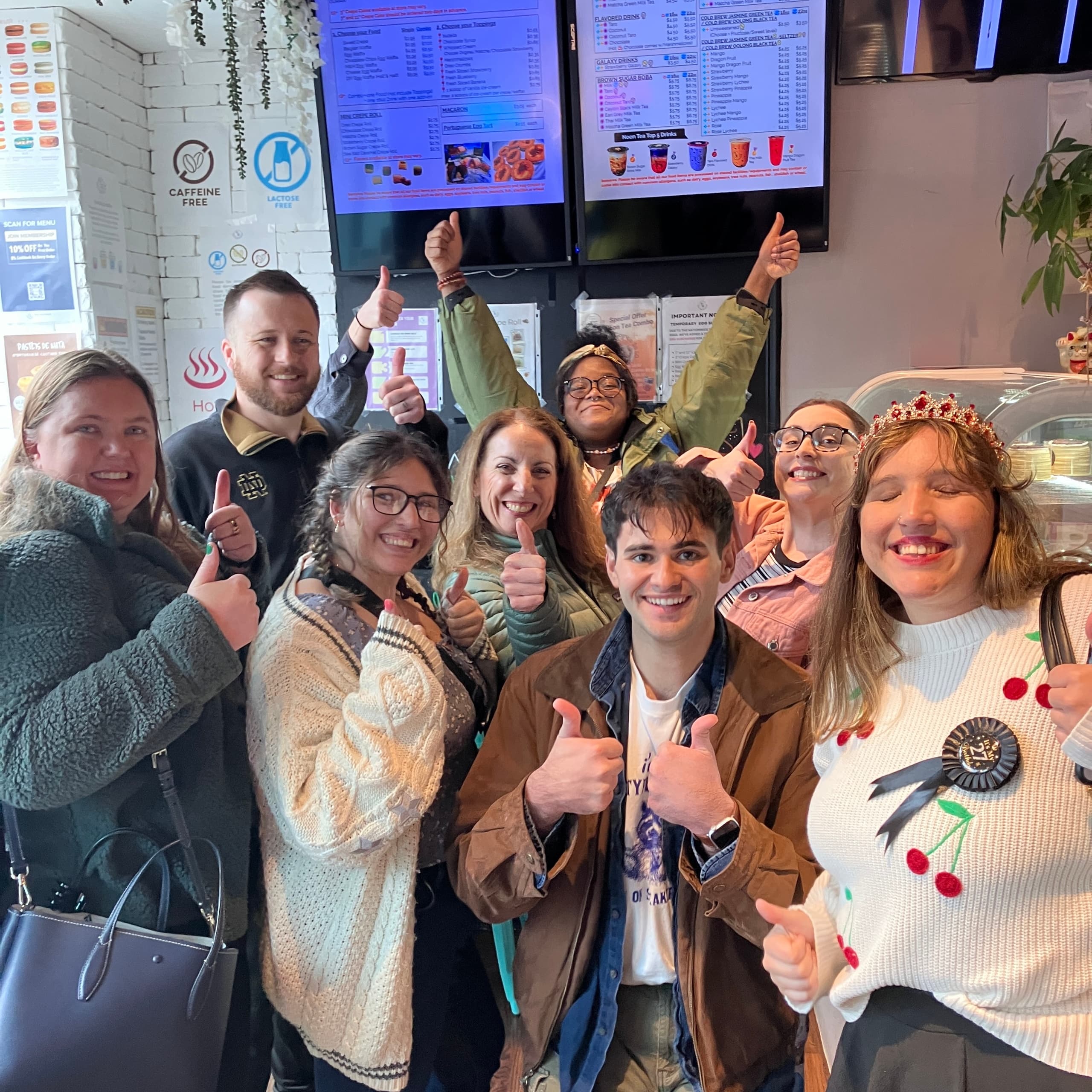 Indoor tasting group inside cozy cafe during food tour