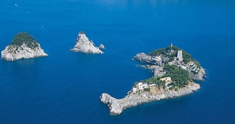 Aerial view of small rocky islands and clear blue sea