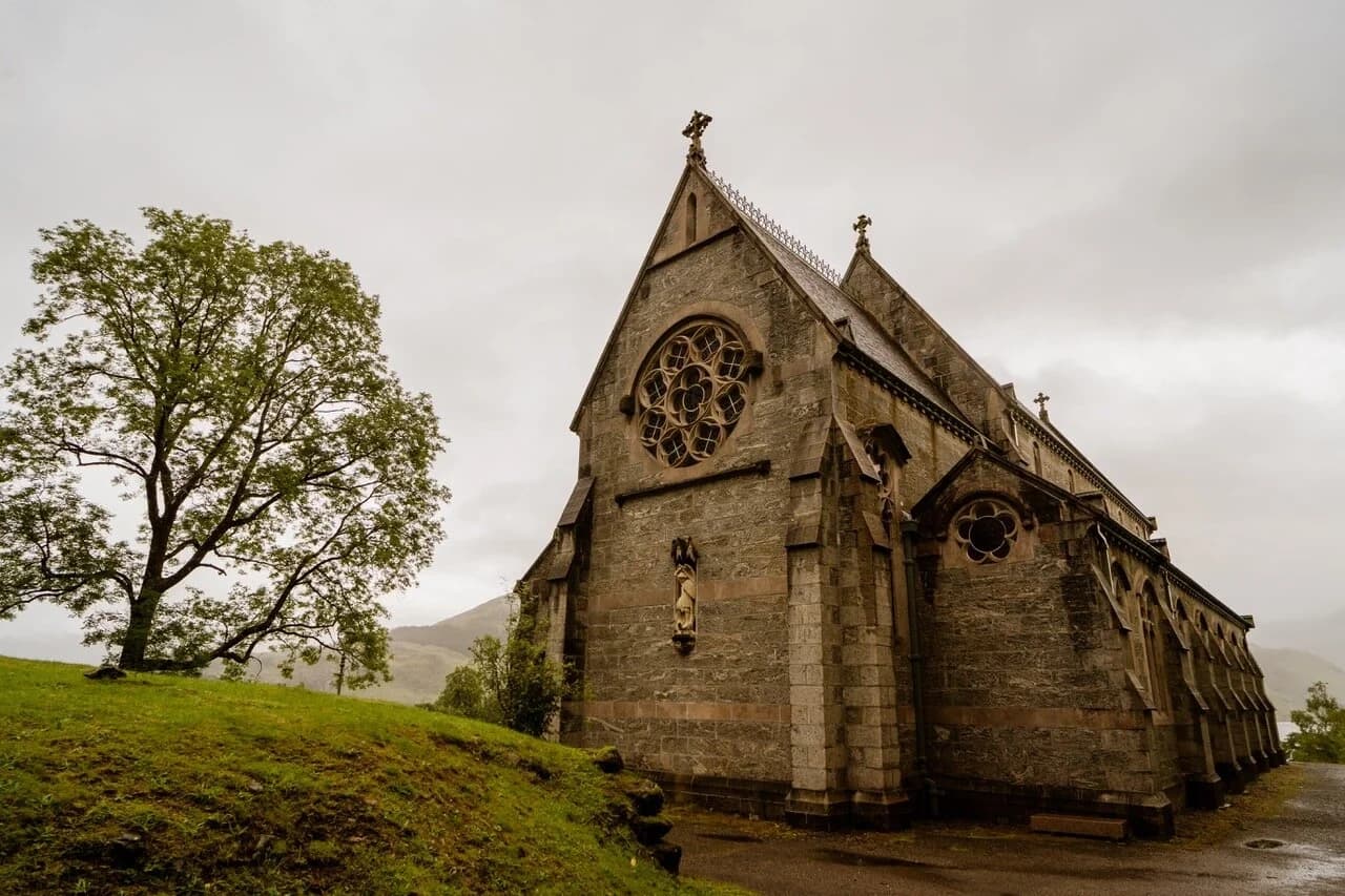 Historic stone church on misty hillside for rural sightseeing tour